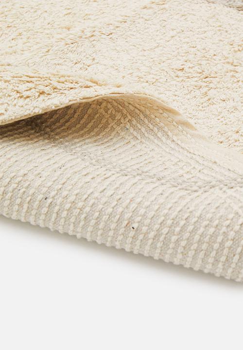 Sixth Floor - Linear tufted round rug - natural