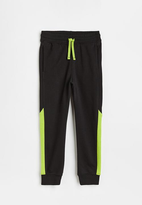 H&M - Sweatpants - black/neon green
