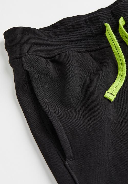 H&M - Sweatpants - black/neon green