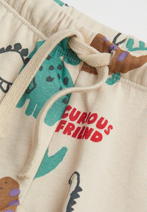 H&M - Cotton joggers - light beige/dinosaurs