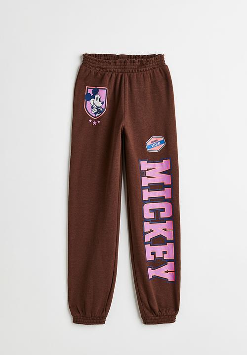 H&M - Printed joggers - dark brown/mickey mouse