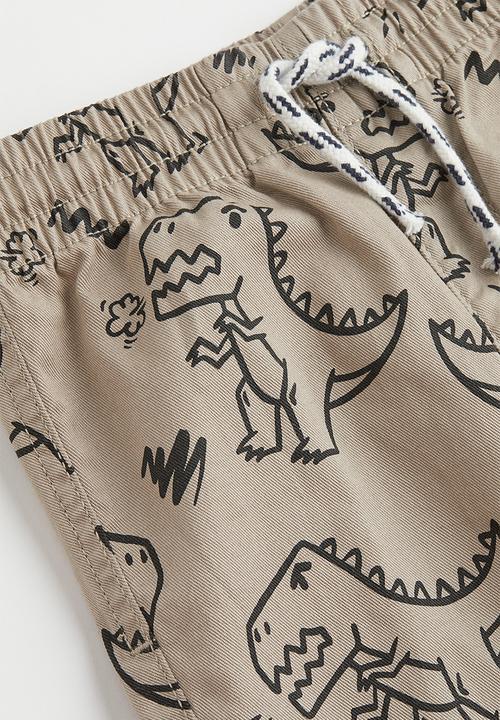 H&M - Relaxed fit joggers - beige/dinosaurs