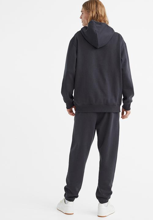 H&M - Regular fit printed sweatpants - dark grey/rose