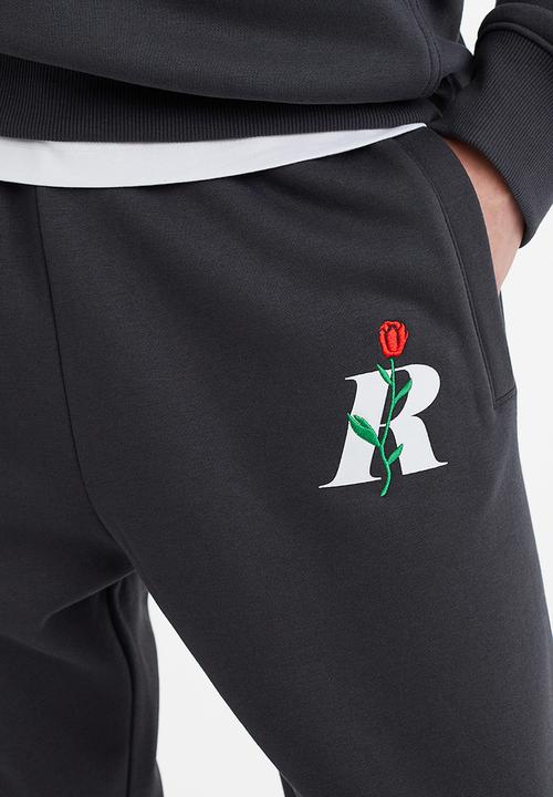H&M - Regular fit printed sweatpants - dark grey/rose