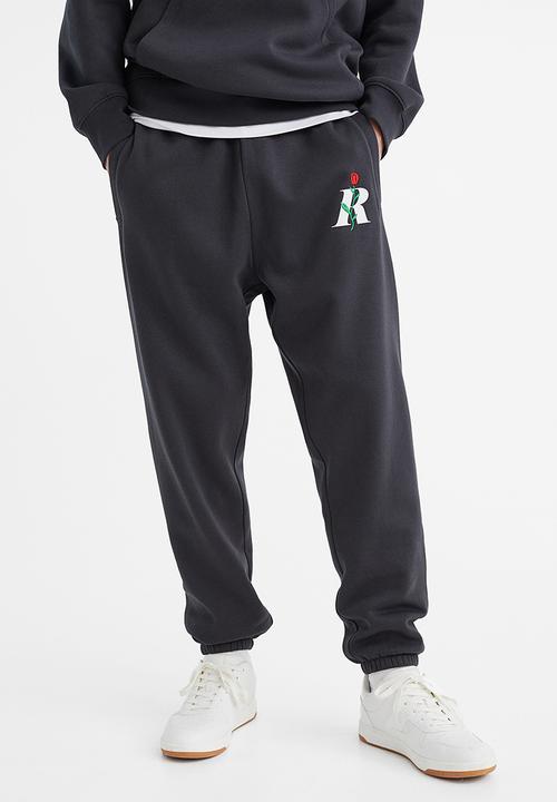 H&M - Regular fit printed sweatpants - dark grey/rose