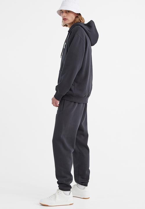 H&M - Regular fit printed sweatpants - dark grey/rose