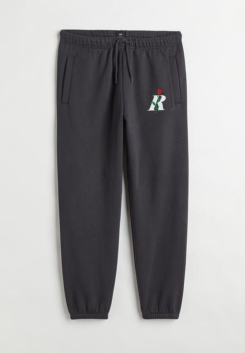 H&M - Regular fit printed sweatpants - dark grey/rose