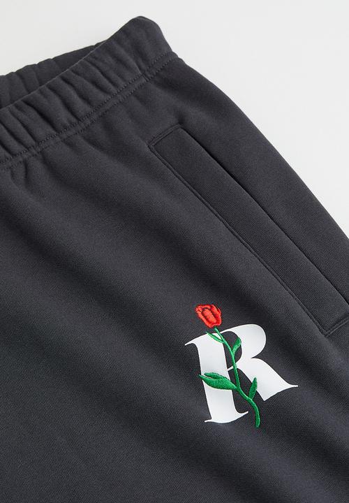 H&M - Regular fit printed sweatpants - dark grey/rose