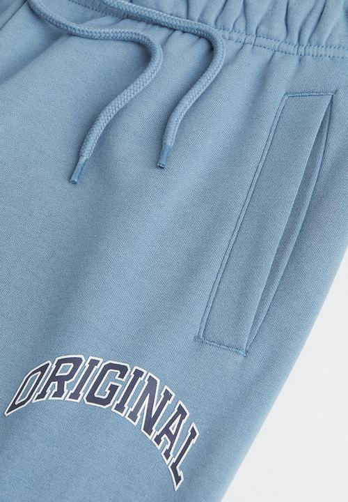 H&M - Regular fit printed sweatpants - light blue/original