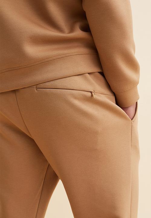 H&M - Fast-drying track pants - beige