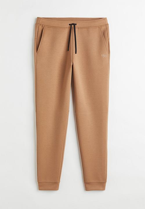 H&M - Fast-drying track pants - beige
