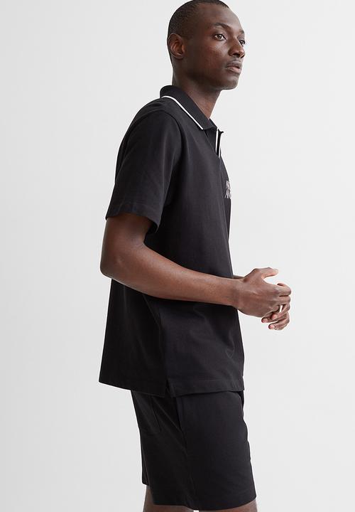 H&M - Regular fit polo shirt - black/arôme
