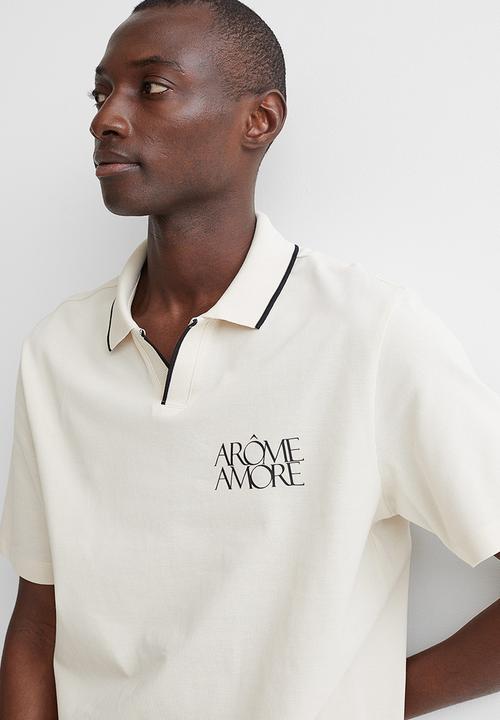 H&M - Regular fit polo shirt - cream/arôme
