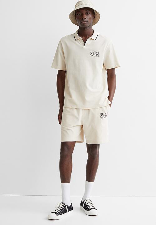 H&M - Regular fit polo shirt - cream/arôme