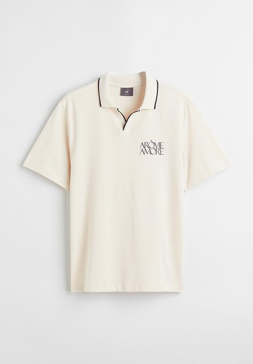 H&M - Regular fit polo shirt - cream/arôme