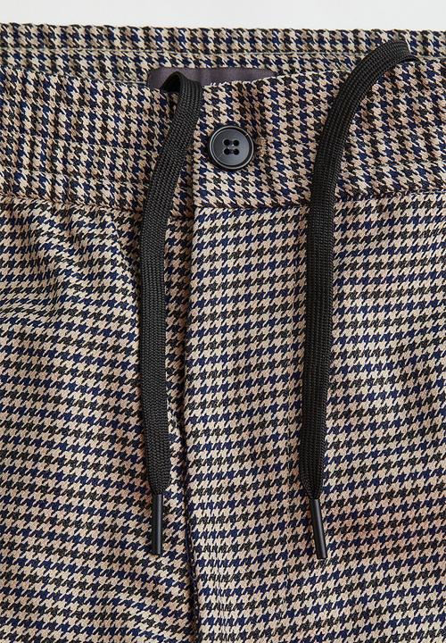 H&M - Relaxed fit suit trousers - light beige/dogtooth patterned
