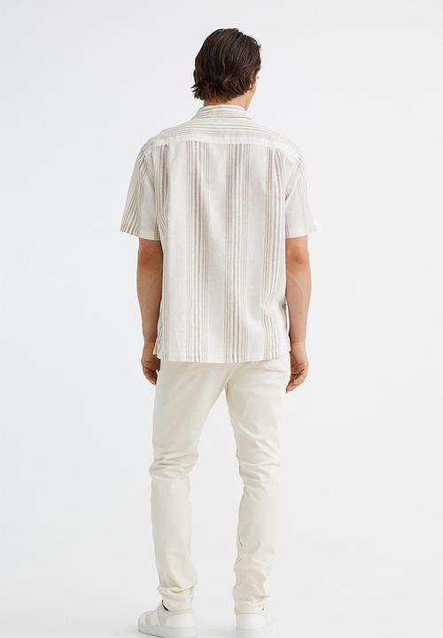 H&M - Slim fit cotton twill trousers - cream