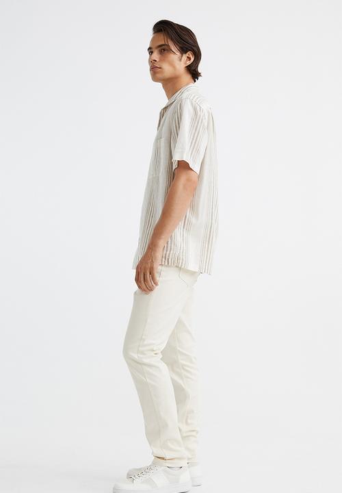 H&M - Slim fit cotton twill trousers - cream