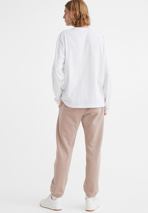 H&M - Regular fit sweatpants - beige/snoopy