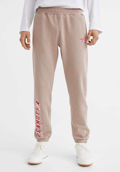 H&M - Regular fit sweatpants - beige/snoopy