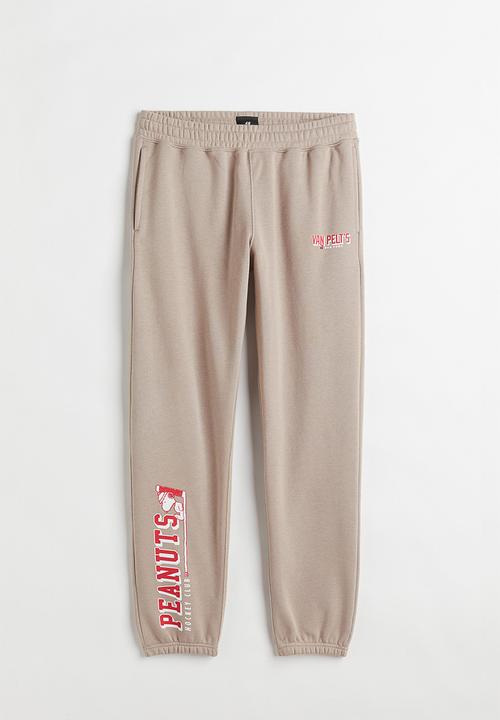 H&M - Regular fit sweatpants - beige/snoopy