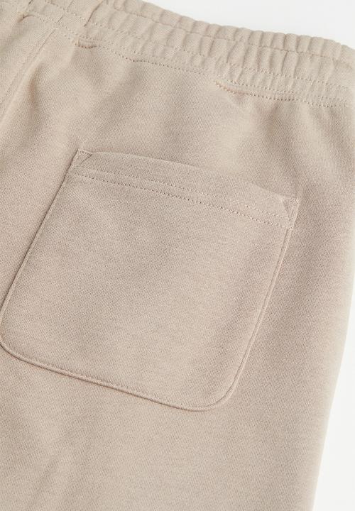 H&M - Regular fit sweatpants - beige/snoopy