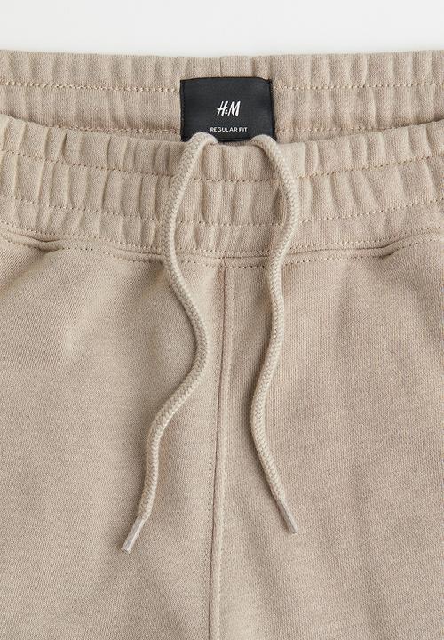 H&M - Regular fit sweatpants - beige/snoopy
