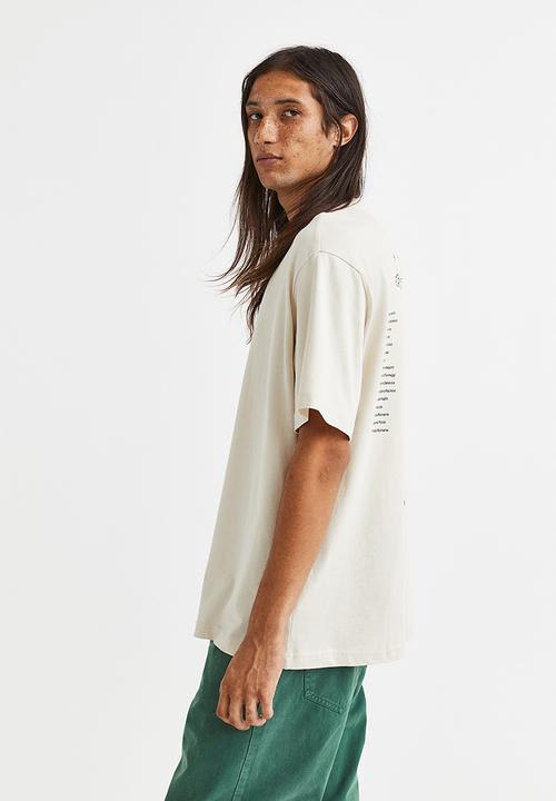 H&M - Relaxed fit printed T-shirt - light beige/trucking