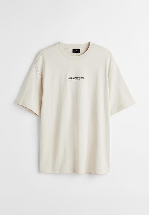 H&M - Relaxed fit printed T-shirt - light beige/trucking