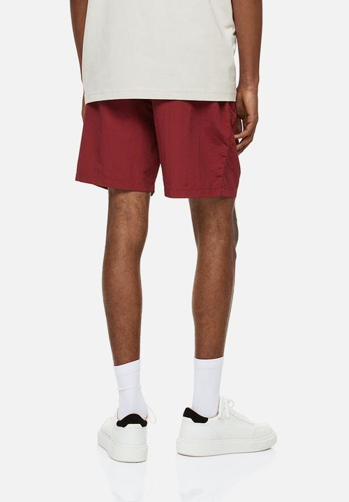 H&M - Relaxed fit nylon shorts - red