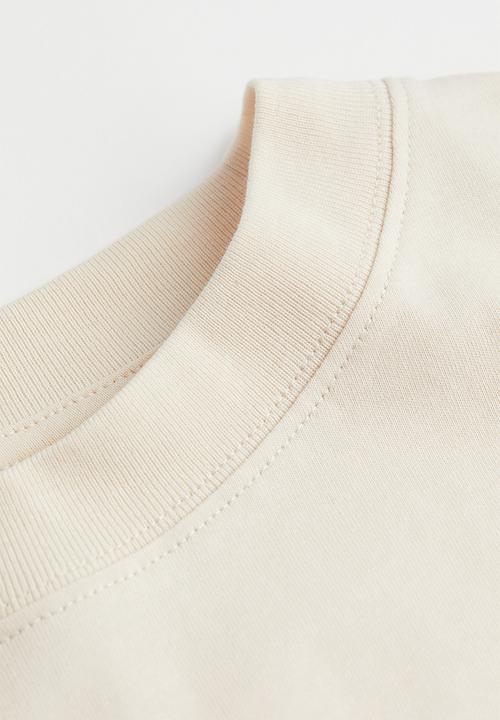 H&M - Oversized printed T-shirt - light beige/nirvana