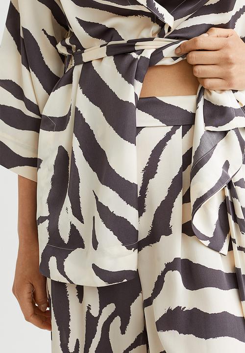 H&M - Wide trousers - cream/zebra print