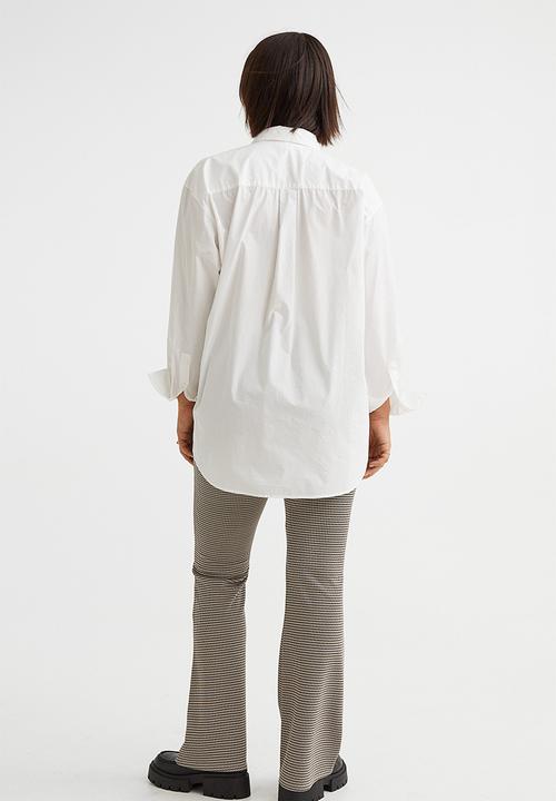 H&M - Flared leggings - beige/dogtooth-patterned