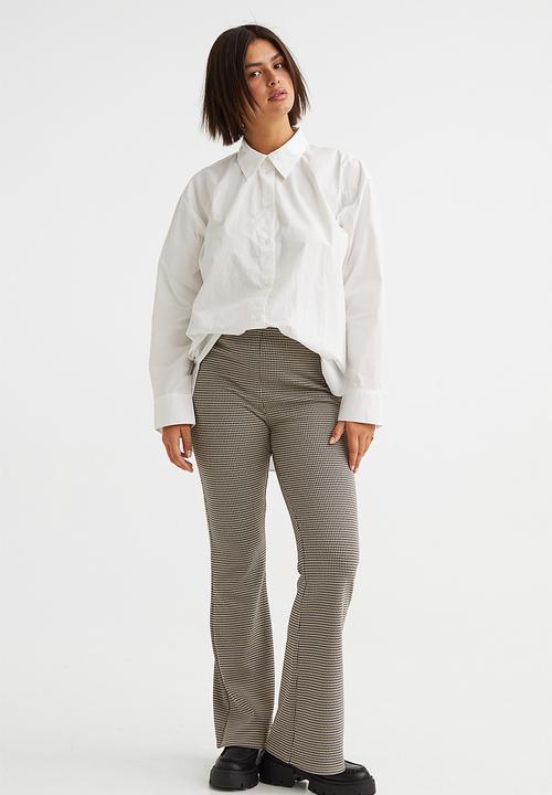 H&M - Flared leggings - beige/dogtooth-patterned
