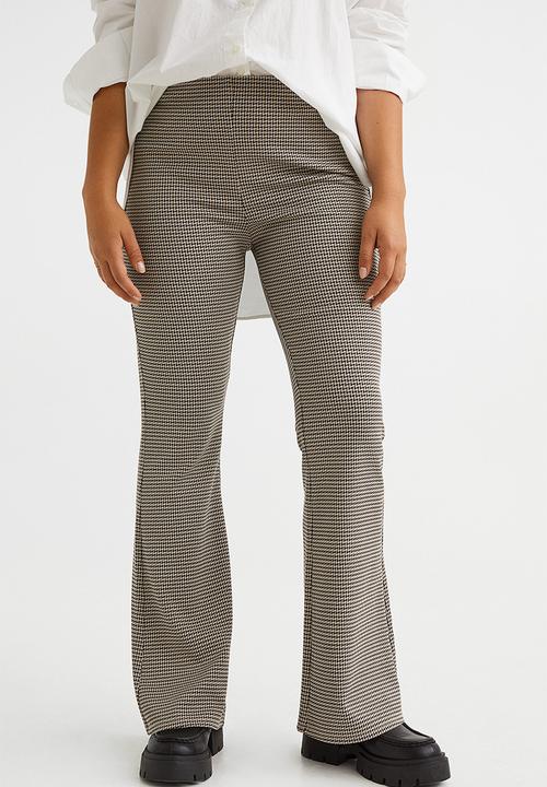 H&M - Flared leggings - beige/dogtooth-patterned