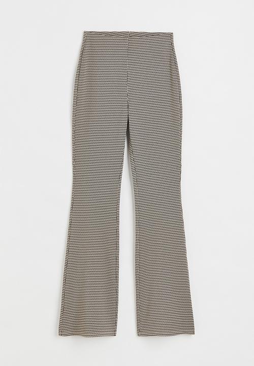 H&M - Flared leggings - beige/dogtooth-patterned