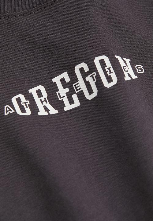 H&M - Cropped printed T-shirt - black/oregon