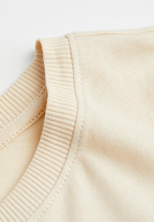 H&M - Cropped printed T-shirt - light beige/globe racing