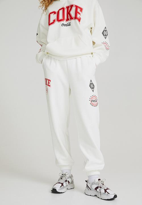 H&M - Printed joggers - white/coca-cola