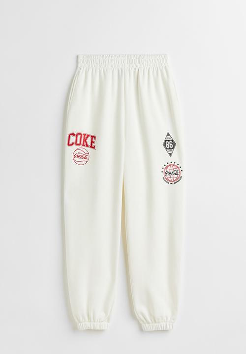 H&M - Printed joggers - white/coca-cola