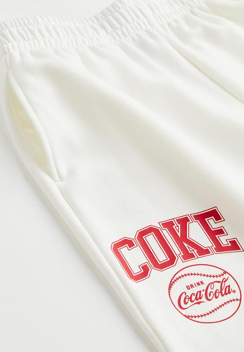 H&M - Printed joggers - white/coca-cola