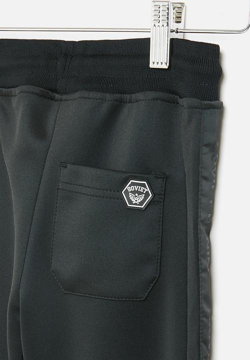 SOVIET - Track pants - black