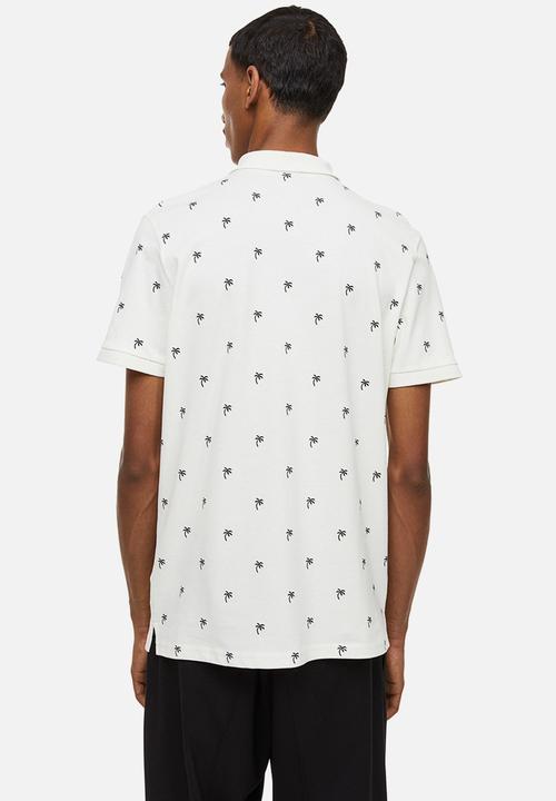 H&M - Slim fit patterned polo shirt - cream/palm trees