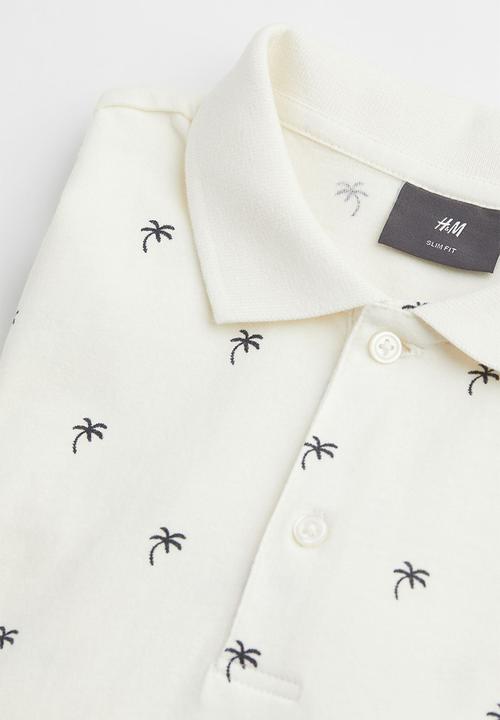 H&M - Slim fit patterned polo shirt - cream/palm trees