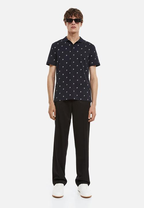 H&M - Slim fit patterned polo shirt - dark blue/palm trees
