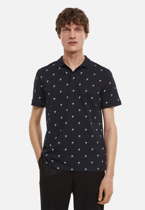 H&M - Slim fit patterned polo shirt - dark blue/palm trees