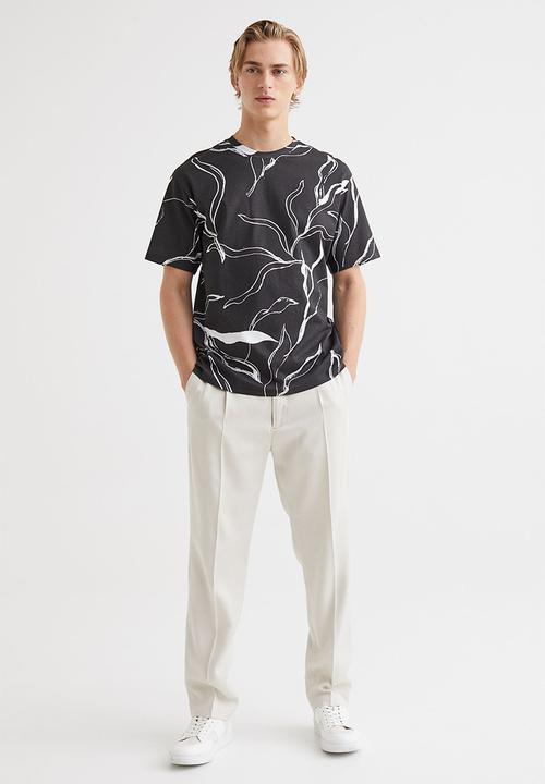 H&M - Relaxed fit patterned cotton T-shirt - black/patterned