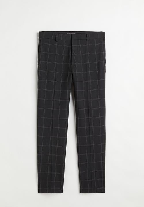 H&M - Slim fit trousers - black/checked