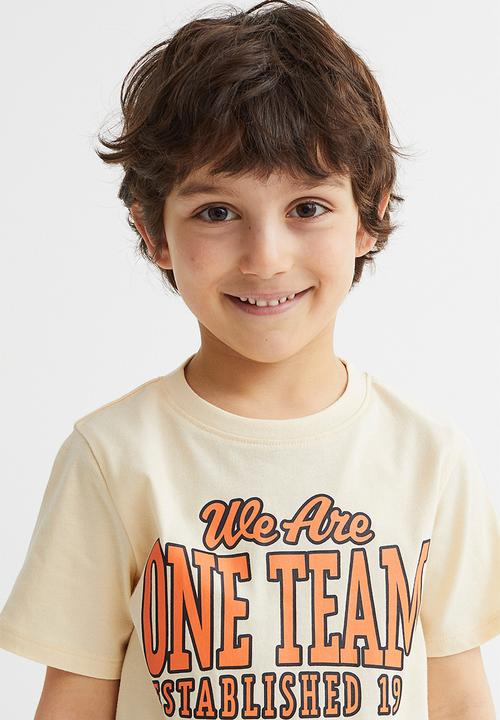 H&M - Cotton T-shirt - light yellow/we are one team