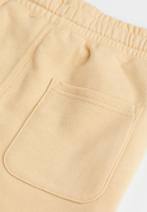 H&M - Sweatshorts - light beige/skate